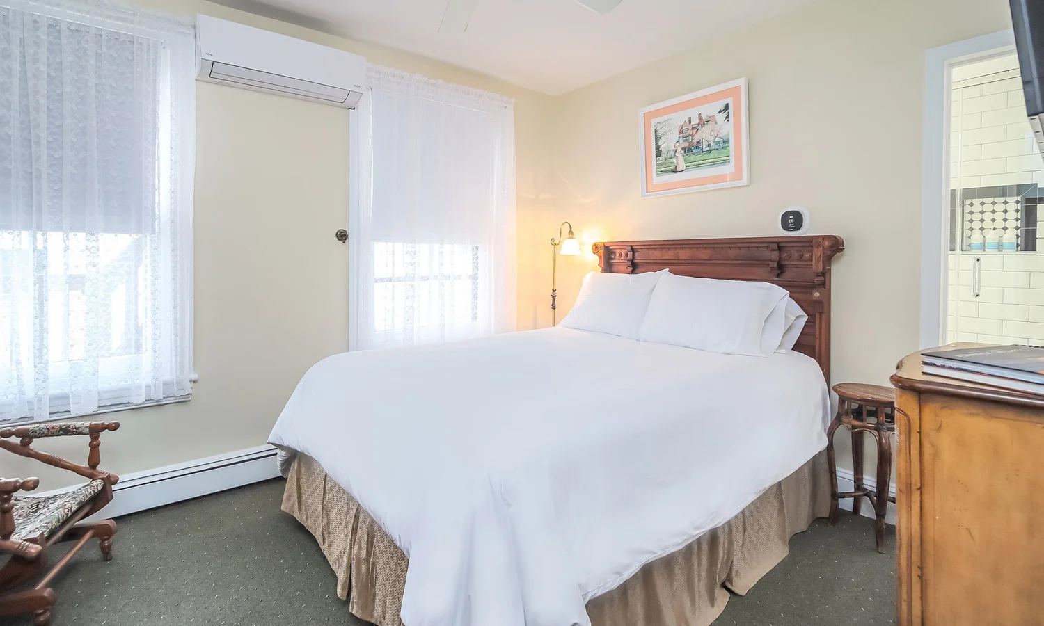 Elizabeth's Room in warm white with a wood bed