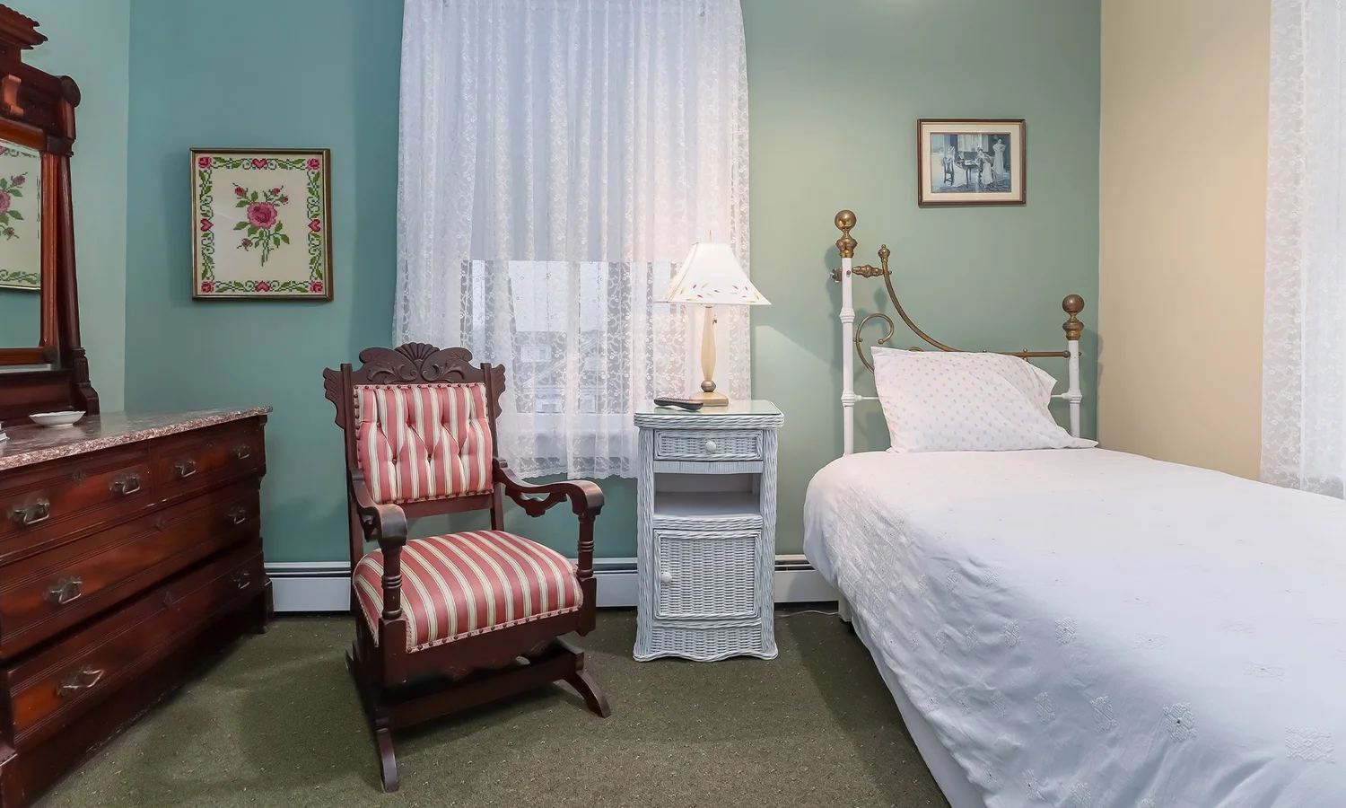 Ellen F. Page Suite twin beds with a striped Victorian rocker