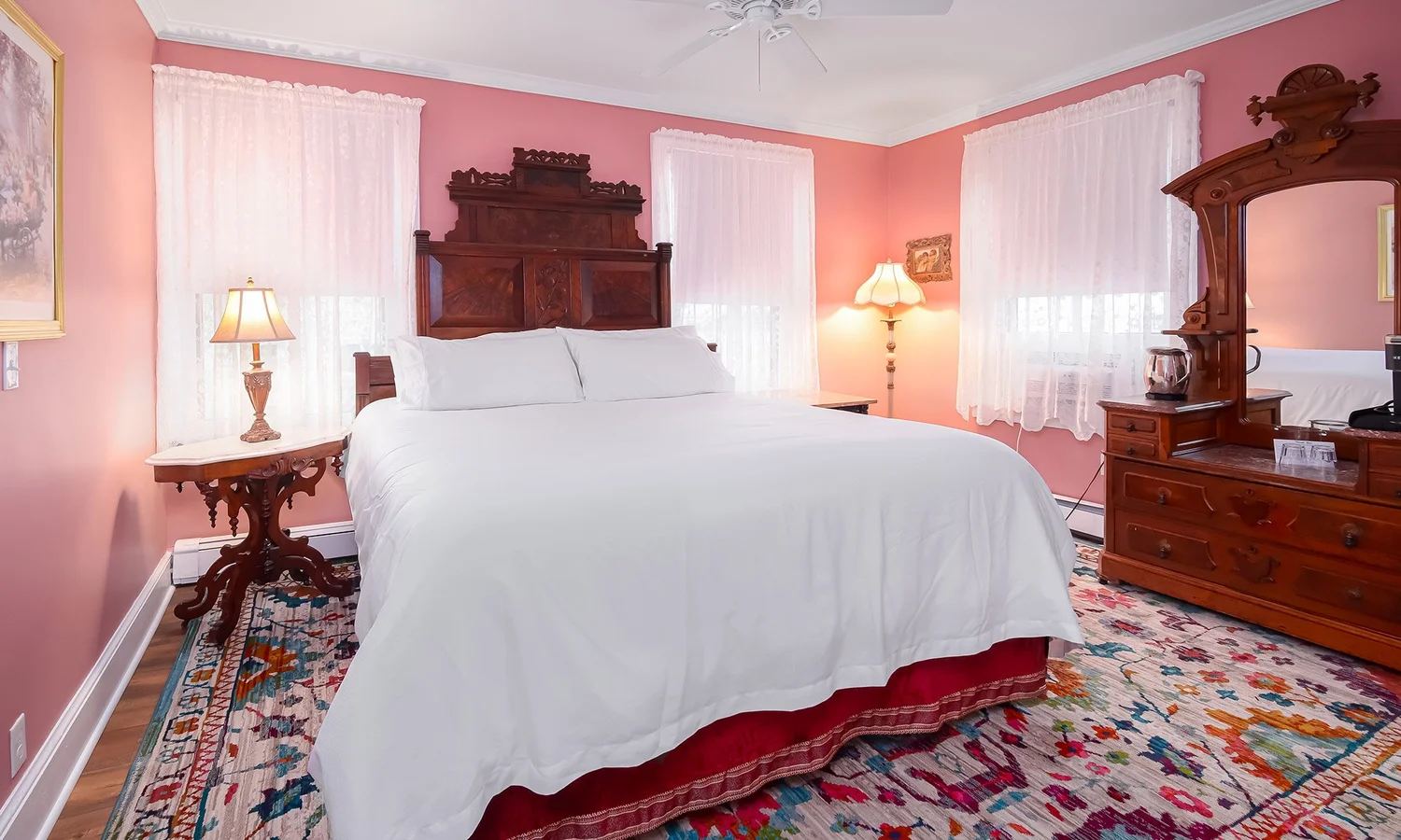 Joseph F. Page Suite bedroom with a carved wood bed