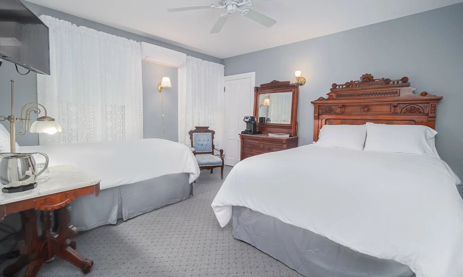 Robert's Room with two beds and carved wood headboards